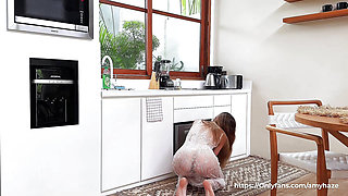 A sexy petite brunette Amy Haze cleaning on kitchen in a transparent dress without underwear