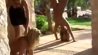 Women tied upside down and whipped