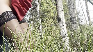 Public fuck in the forest leaning on the tree