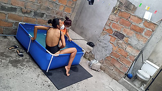 My neighbor is in the pool wearing a very tempting and sexy bikini. She's hot.