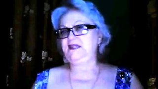 Russian granny ex-teacher flashing her big tits on  webcam