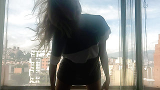 Dancing at the window in full view of the neighbors