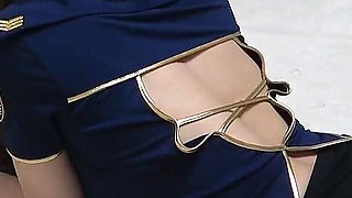 Busty Flight Attendant in No Bra, Miniskirt, Wedgie Thong Panties, and Stockings During Sexy Fitness Training in Apartment