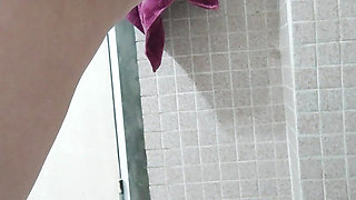 Busty wife fingers in pussy and ass in the bathroom