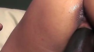 Sexy babe gets spitroasted by two huge black cocks