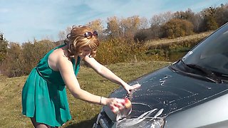 Sexy mature blonde milf washes car by the riverbank without panties and bra under her dress