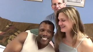 A nerdy technician invites a black friend to fuck his flat-chested wife in bed with him