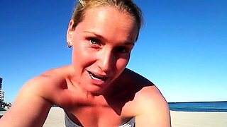 Chick masturbating outdoors on a beach