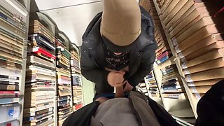 Amateur couple gets frisky in the library with a POV blowjob and swallowing