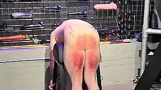 Slave in Chastity Cage Gets a Cruel Caning