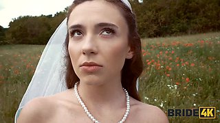 BRIDE4K. Pretty brunette bride fucks a horny shepherd in a summer field