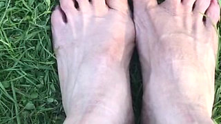 Melove Showing Her Sexy Small Feet on Green Grass