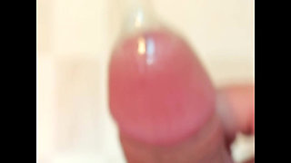 Cum again inside condom filled with semen.