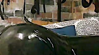 Large Strap-on Gapes Gigi in Latex Catsuit