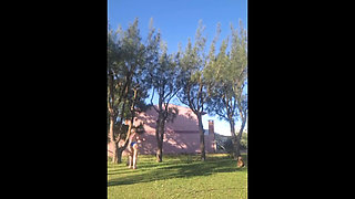 Stepmother in a Bikini in the Garden of the House Makes a Video for Her Stepson, to Show off Her New Clothes.