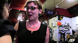 MILF in glasses spanks her stepdaughter's ass in the shop