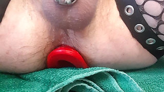 Cumshot in a cage for mistress with wholesale tunnel plug