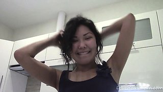 Cute Asian gets completely naked in the bathroom