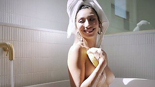 Big tits petite Latina strips in bathtub