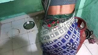 Sister-in-law was cutting papaya in the kitchen and the brother-in-law from behind.