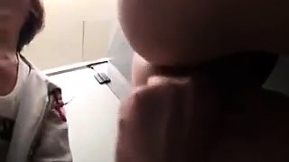 Horny Oriental teen enjoys doggystyle sex in a public toilet