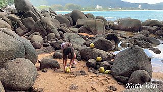 Naked Girl Found a Coconut on a Beach and Poured the Juice Over Her Body