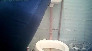 Mature pale skin white lady pulls down her jeans in the toilet