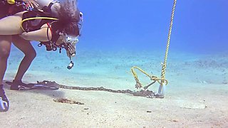 Bizzare sex session during SCUBA diving. She takes a huge cock while being 100m underwater