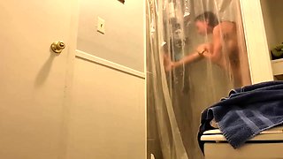 Hidden camera captures sexy stepsister taking a shower