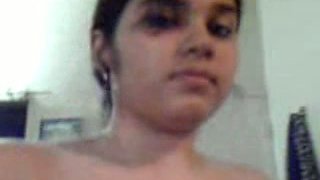 Fatty Indian teen playing with her huge boobies in a bathroom