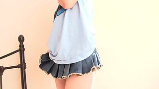 Redhead teen shows her small tits on the bed