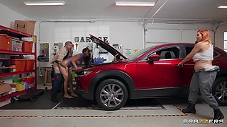 Brunette and Redhead Oiled and Spoiled at the Car Garage with Scott Nails, Bella Rolland, Taylor Gunner