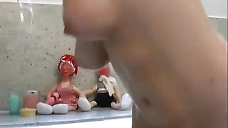 Two beautiful lesbians masturbate their pussies while relaxing in the tub
