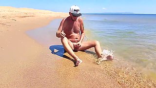 Nudist Couple Having Pegging Session On The Beach