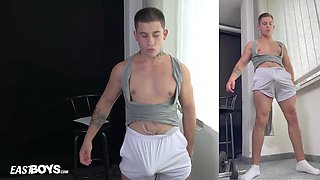 Muscular guy flexing with his rod