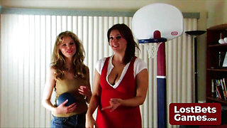 Two stunning girls engage in a playful strip game of Snip Basketball