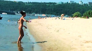Hot nudist teen filmed by voyeur as she sits naked outside