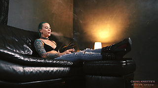 Anette Smokes in Jeans and Boots 4K