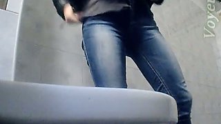 Sweet white booty of a stranger girl in blue jeans filmed in the toilet