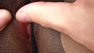 Close-up tight hole in torn pantyhose!