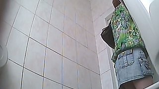 Chunky white stranger chick in denim skirt pisses in the toilet