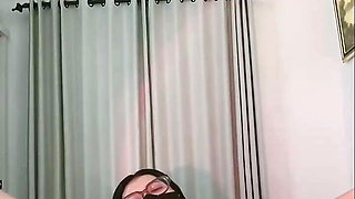 Masturbating in the morning with a dildo, accompanied by an Indonesian girl.