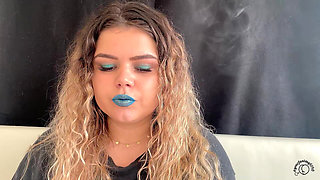 Exotic Goddess with Wild Hair Blows Smoke for You