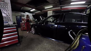 Cute Female Mechanic Plays Solo in the Car Service