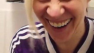 Blonde Sporty MILF Pisses in a Cup Wearing a Sports Jersey, Then Her Man Drinks the Piss