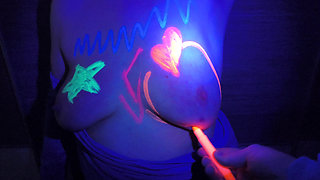 Her tits glowing in the dark