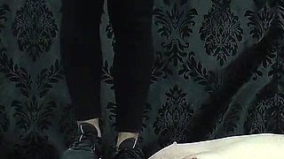 Under Nomi's Black Nike Sneakers