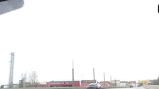 Sexy light-haired babe drains in a car solo
