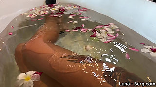 Bath of Blossoms Naked MILF Masturbates Among Flowers