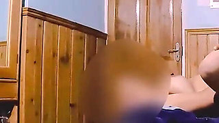 Passionate Couple Making Love in a Hotel Room